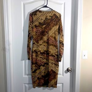 Form-fitting long sleeve animal print body-con. Lightweight